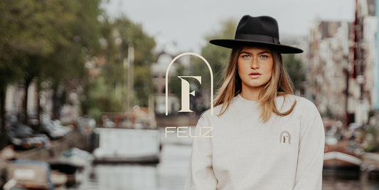girl with hat on amsterdam canal shopping guide