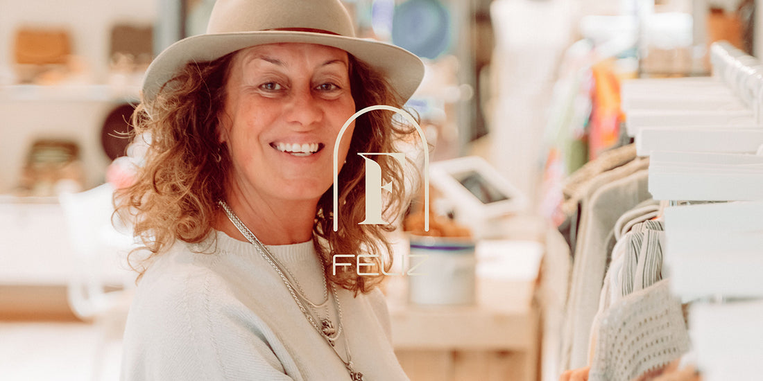 woman with hat in shop smiling designer founder feliz shoes